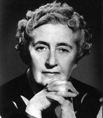 Black and white photograph of an older Agatha Chistie with her hands near her chin